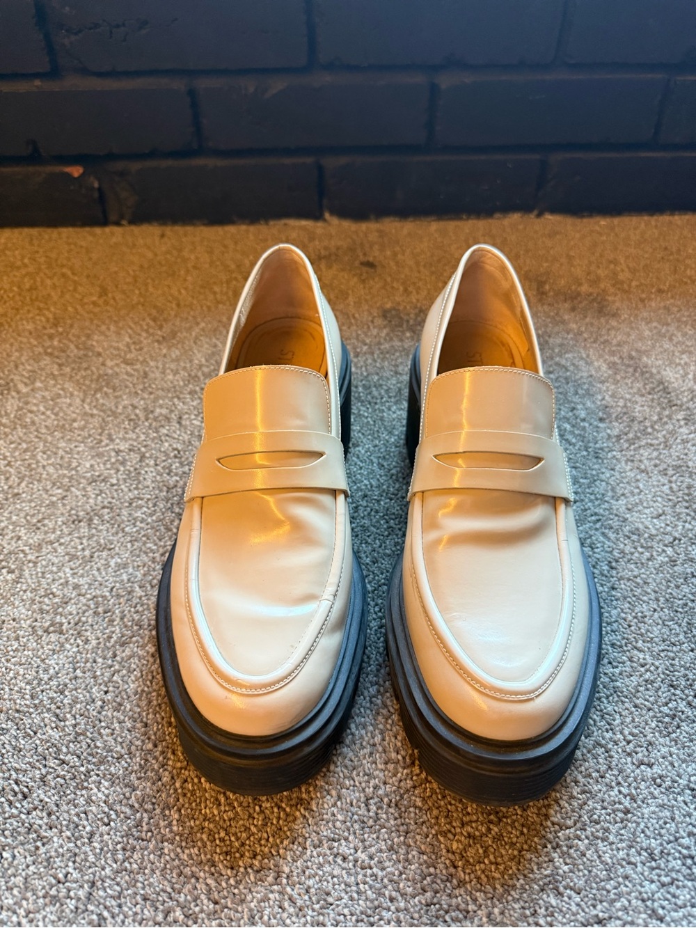 Stuart Weitzman Cream Leather Penny Loafers with Black Platform